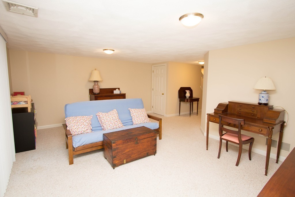 13 Deer Path, Unit 3 Maynard, MA 01754 - Photo 14 of 21 a living room with furniture and a window