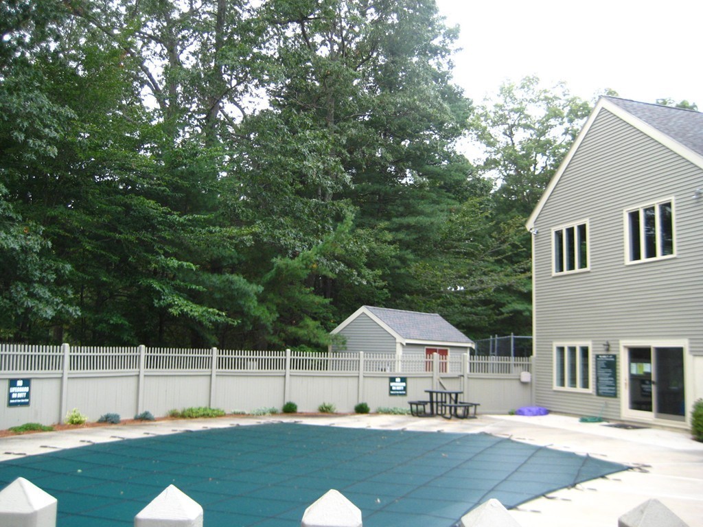 13 Deer Path, Unit 3 Maynard, MA 01754 - Photo 18 of 21 a swimming pool view with a seating space and a garden view