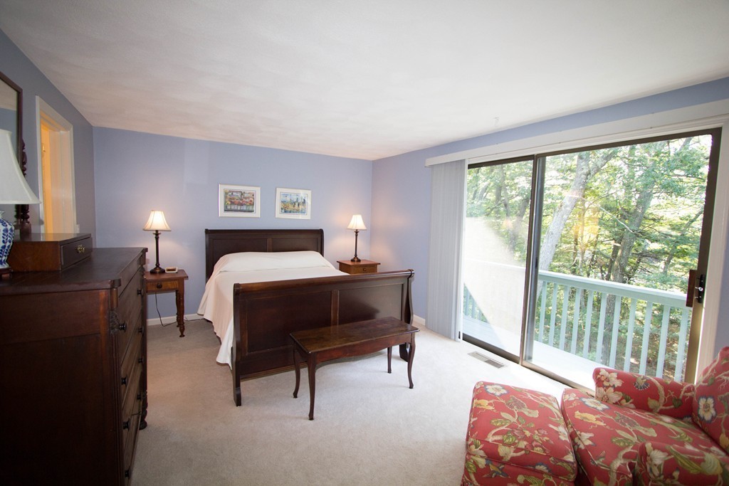 13 Deer Path, Unit 3 Maynard, MA 01754 - Photo 8 of 21 a bedroom with a bed and a window
