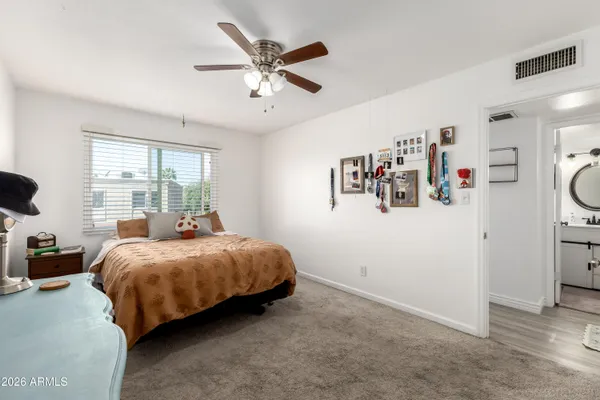 a bed room with a bed and a window