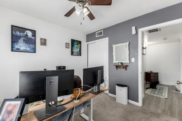 a view of a workspace with furniture