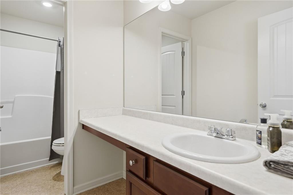 123 Renford Road Ball Ground, GA 30107 - Photo 20 of 27 a bathroom with a sink and a mirror