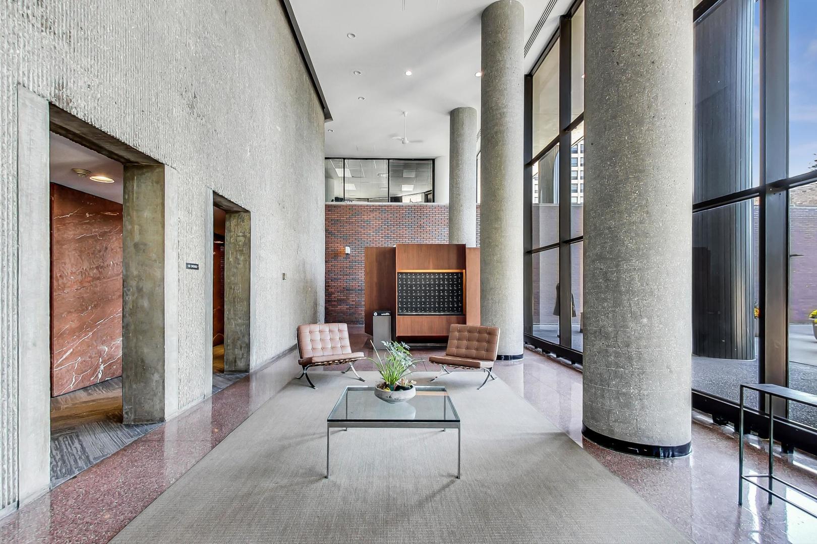 5415 North Sheridan Road, Unit 2904 Chicago, IL 60640 - Photo 11 of 49 a living room with furniture