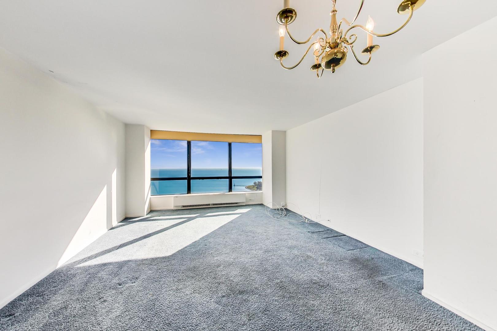 5415 North Sheridan Road, Unit 2904 Chicago, IL 60640 - Photo 20 of 49 an empty room with a empty space and a window