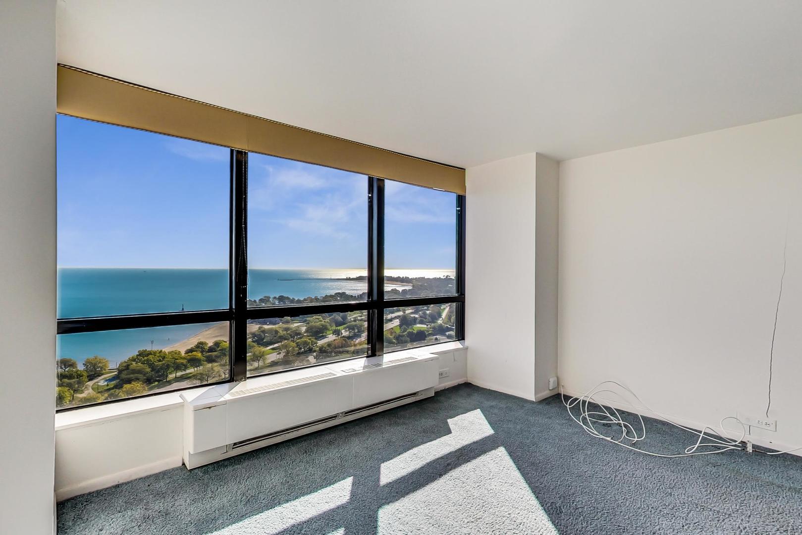 5415 North Sheridan Road, Unit 2904 Chicago, IL 60640 - Photo 23 of 49 an empty room with large windows