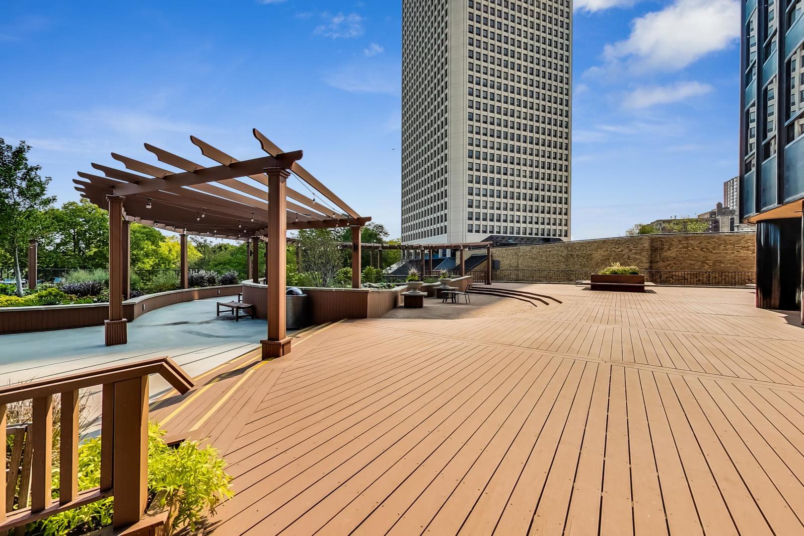 5415 North Sheridan Road, Unit 2904 Chicago, IL 60640 - Photo 40 of 49 a view of a terrace with wooden floor and outdoor space