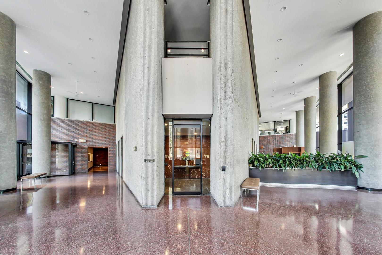 5415 North Sheridan Road, Unit 2904 Chicago, IL 60640 - Photo 10 of 49 a view of an entryway with a flower pot and wooden floor