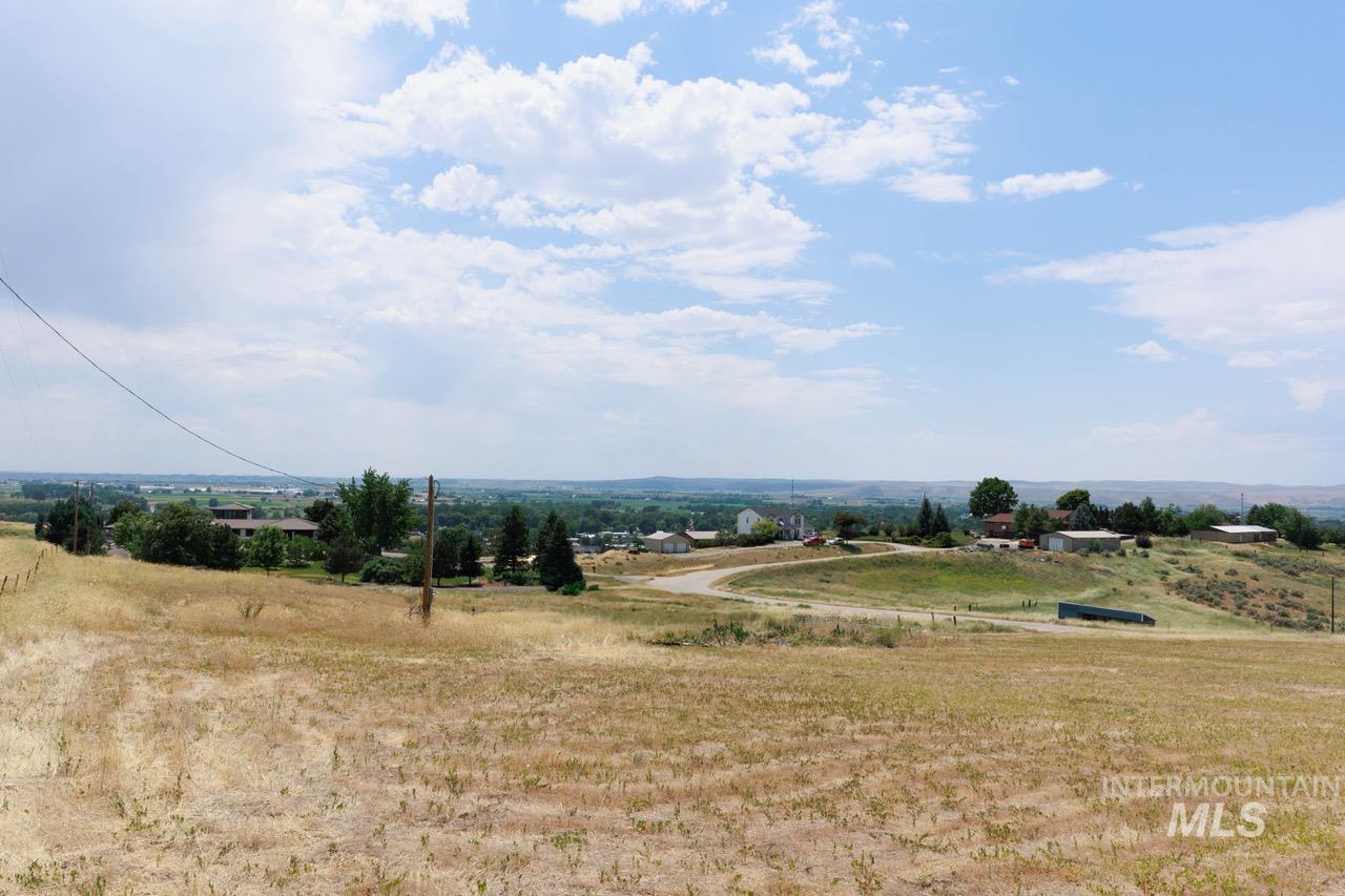 View of mountain backdrop featuring rural landscape