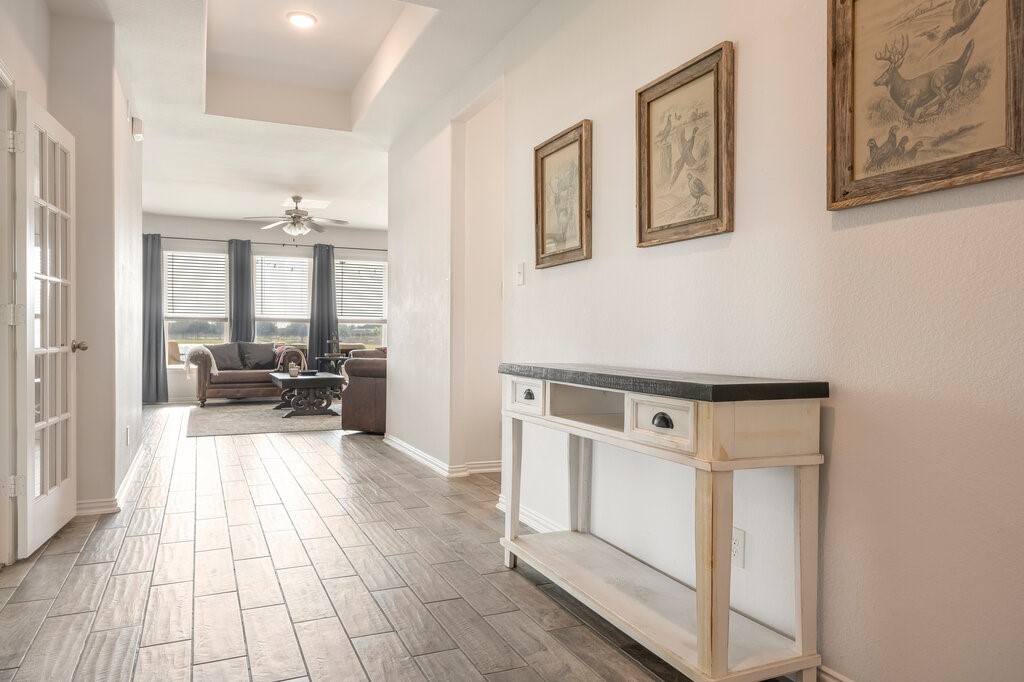 105 Montecito Lane Manvel, TX 77578 - Photo 17 of 39 a view of a hallway with furniture and couches