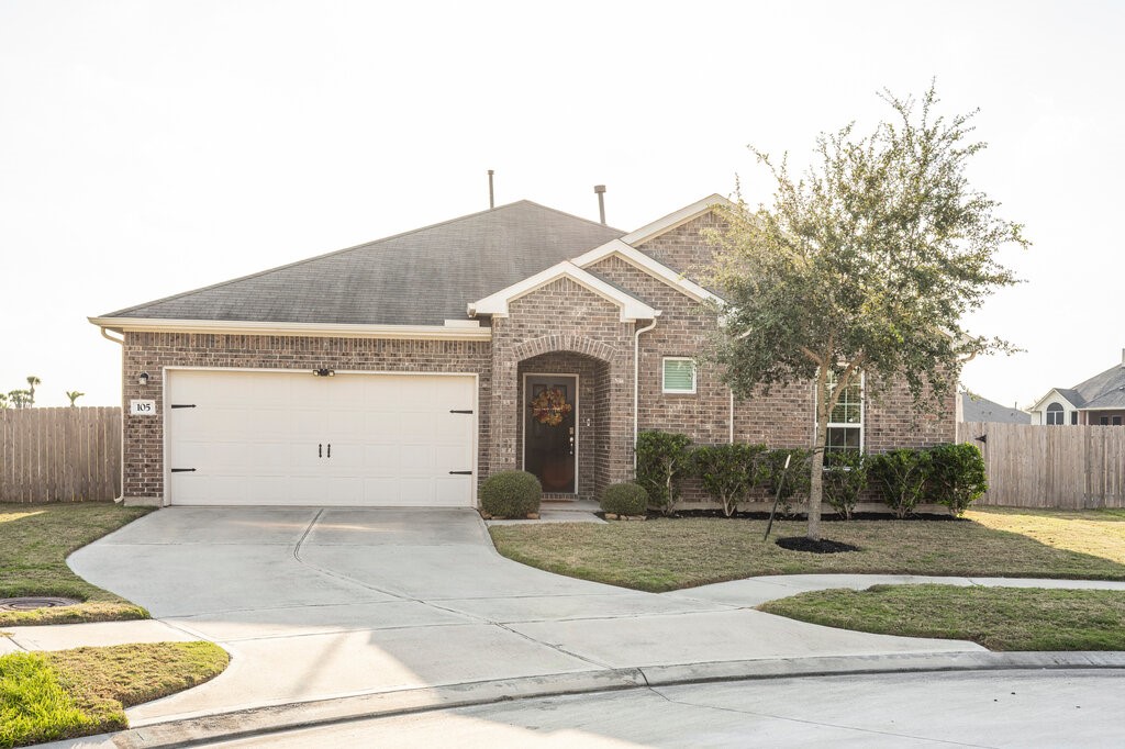 105 Montecito Lane Manvel, TX 77578 - Photo 2 of 39 a front view of a house with garden