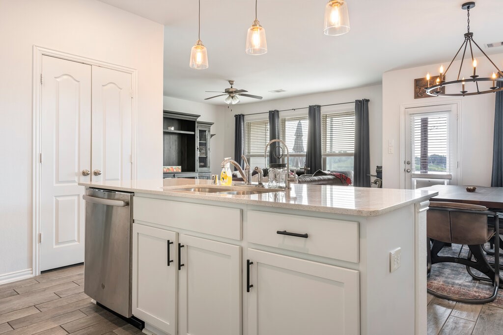 105 Montecito Lane Manvel, TX 77578 - Photo 30 of 39 a kitchen with cabinets and sink