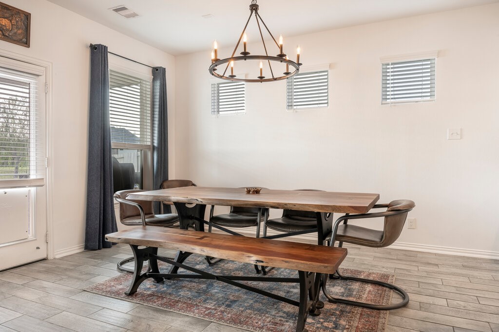 105 Montecito Lane Manvel, TX 77578 - Photo 32 of 39 a room with wooden floor and windows