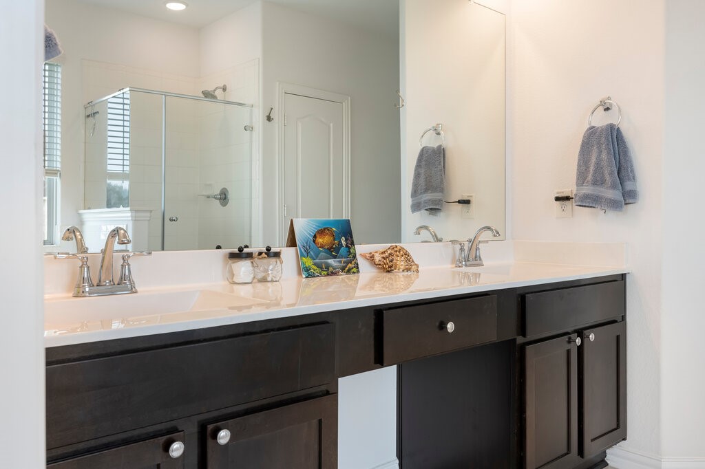 105 Montecito Lane Manvel, TX 77578 - Photo 33 of 39 a bathroom with a sink vanity and a mirror