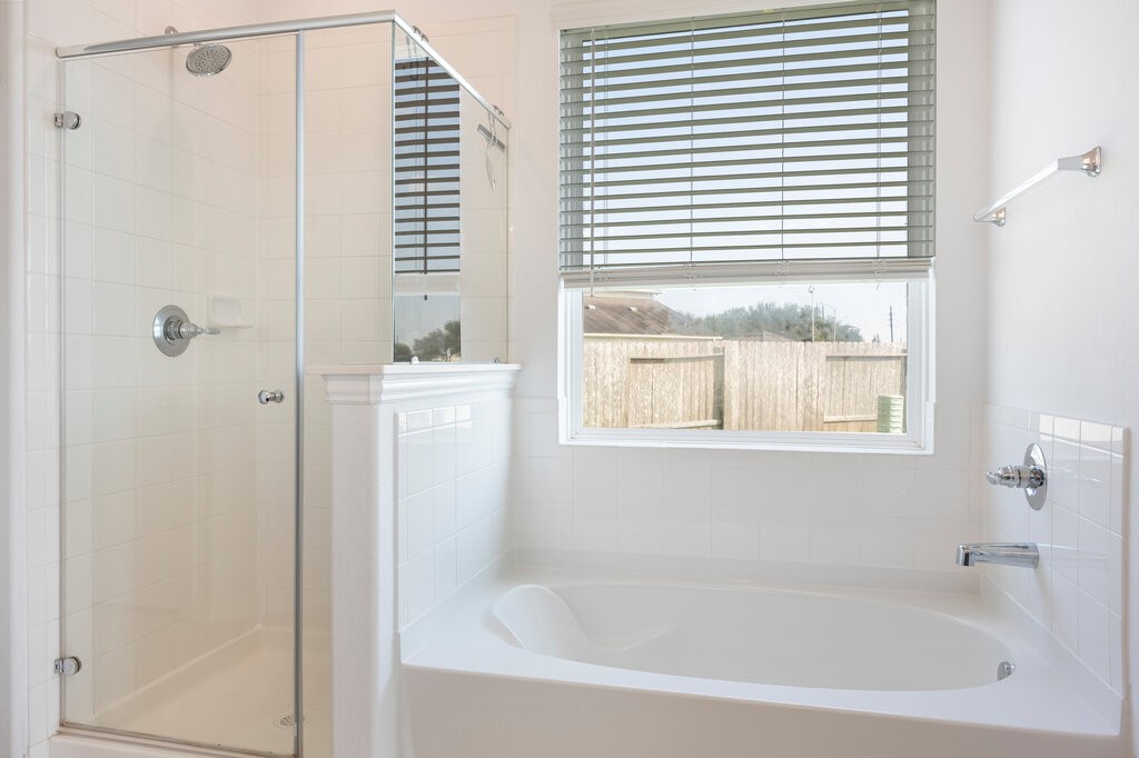 105 Montecito Lane Manvel, TX 77578 - Photo 34 of 39 a white bath tub with a shower