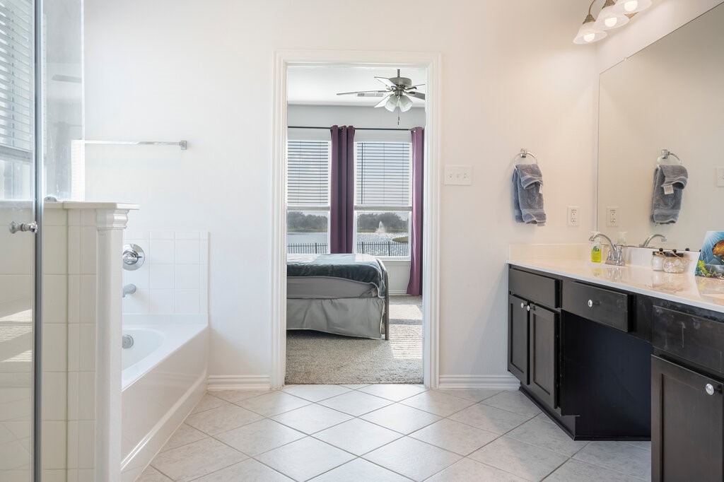 105 Montecito Lane Manvel, TX 77578 - Photo 35 of 39 a bathroom with a tub sink and mirror
