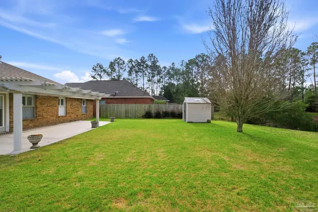 a front view of a house with a garden and plants