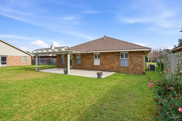 a front view of a house with yard