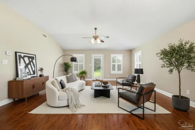 a living room with furniture and a large window