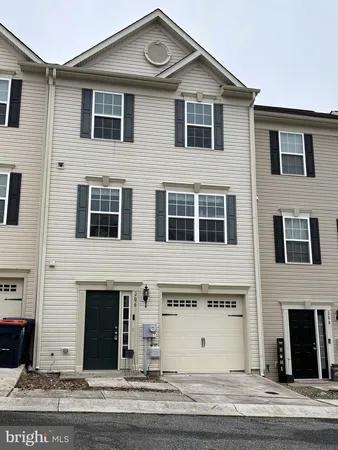 a view of a house with a parking area