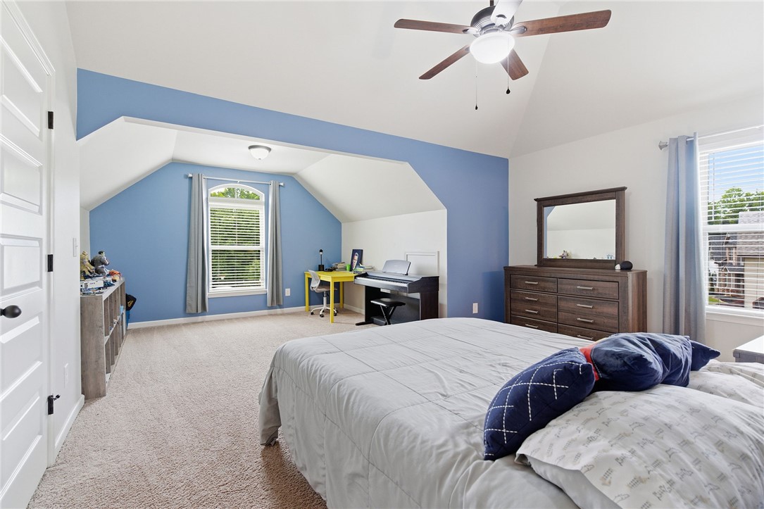 138 Buckland Drive Anderson, SC 29621 - Photo 33 of 49 This spacious bedroom features vaulted ceilings and ample natural light, creating a bright and airy retreat.