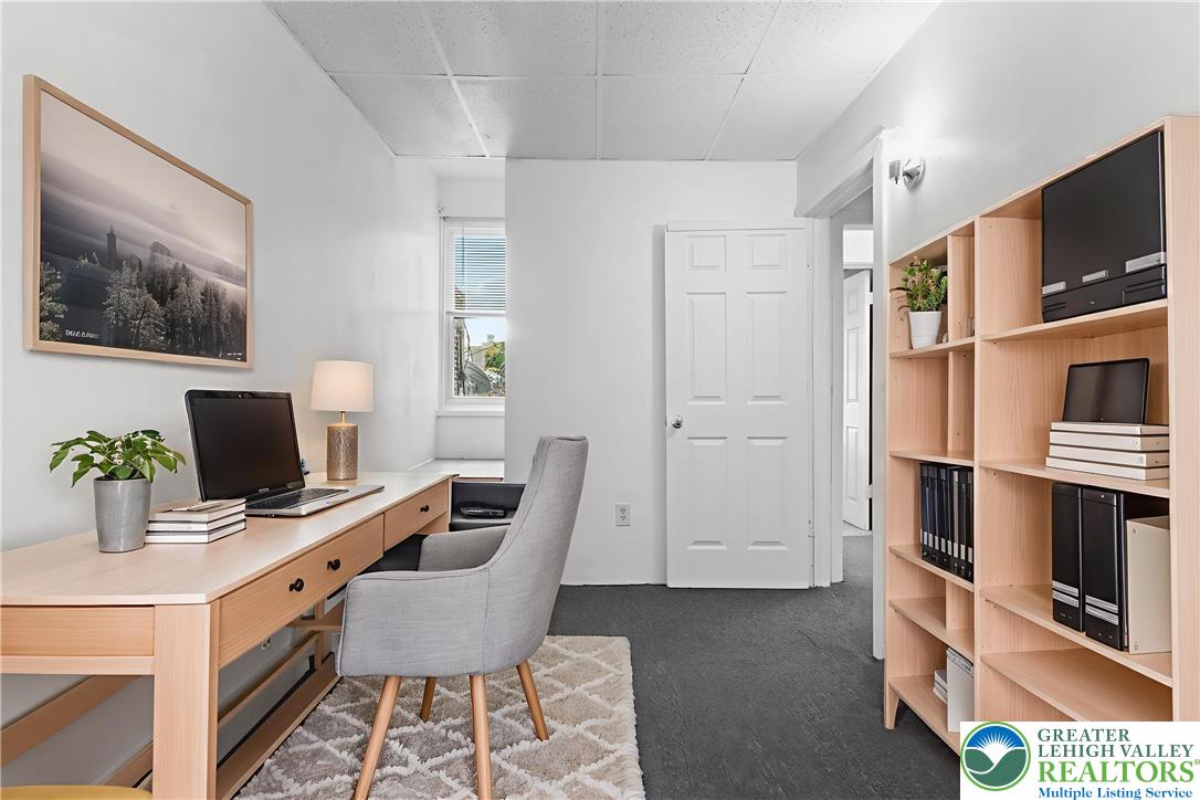 424 Cedar Street Allentown, PA 18102 - Photo 15 of 27 a work room with furniture and flat screen tv