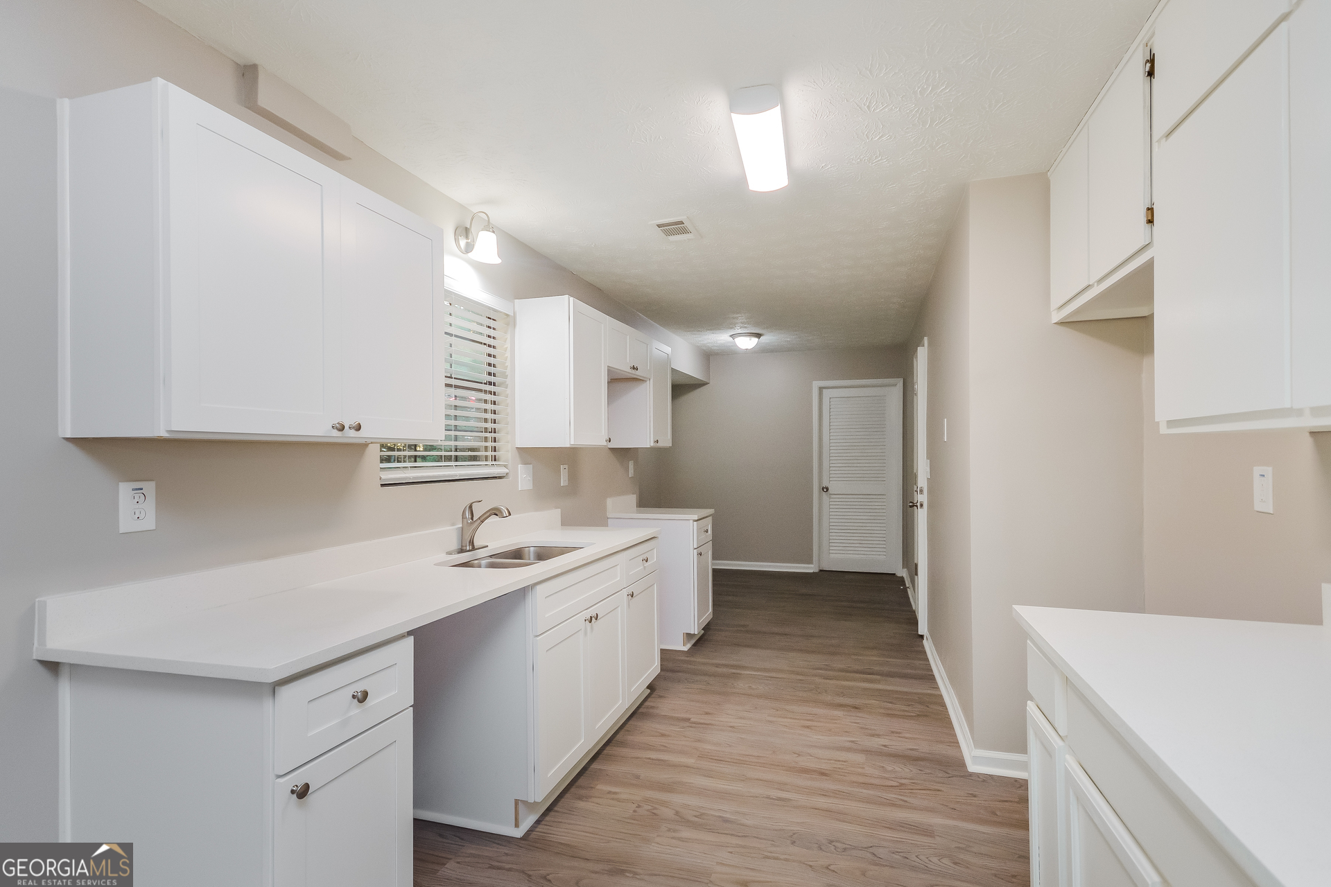 4585 Old Lake Drive Decatur, GA 30034 - Photo 6 of 16 a kitchen with a sink a stove and cabinets