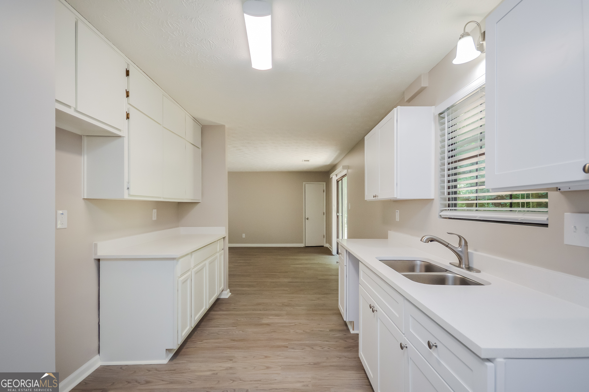 4585 Old Lake Drive Decatur, GA 30034 - Photo 7 of 16 a kitchen with a sink a stove and cabinets
