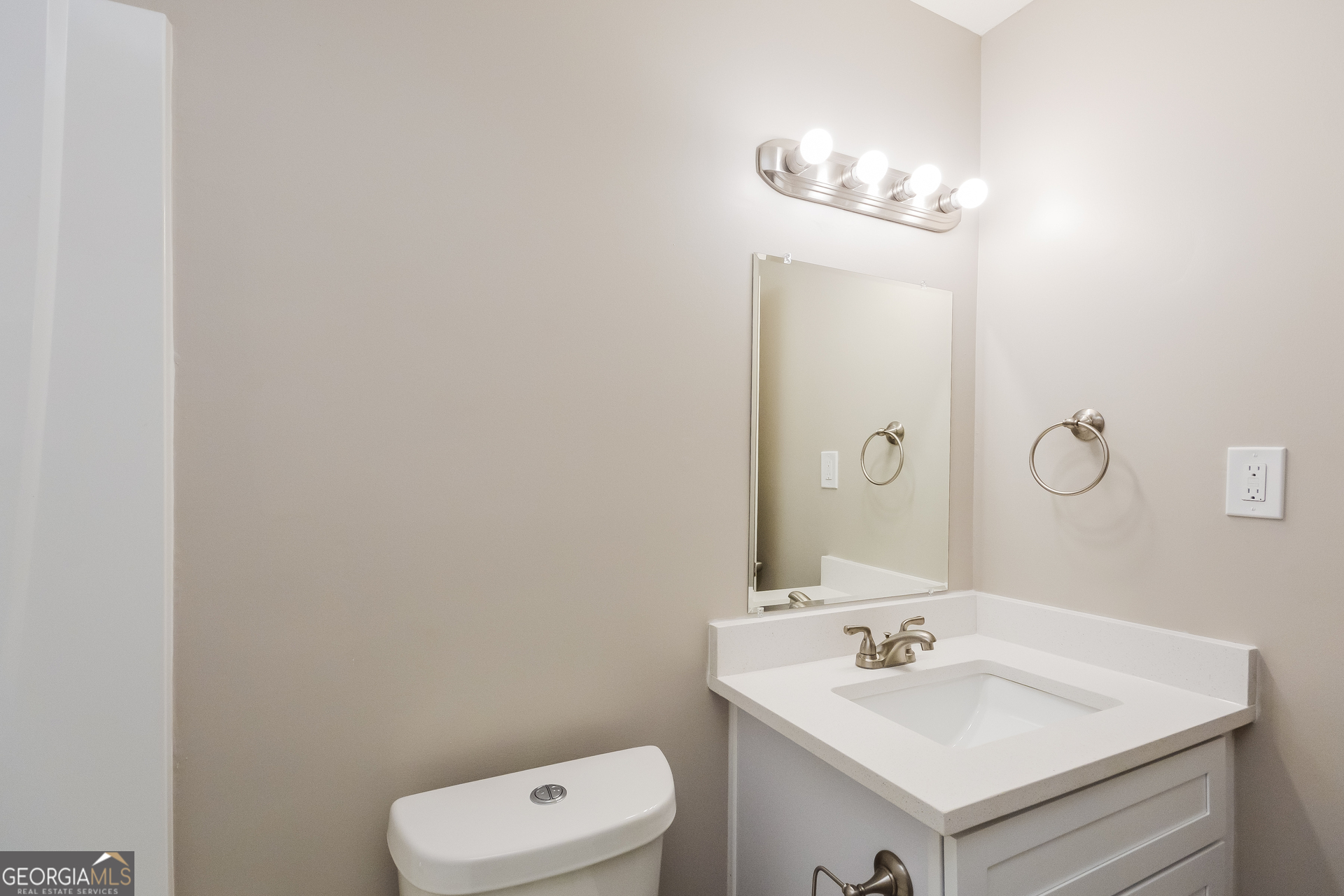 4585 Old Lake Drive Decatur, GA 30034 - Photo 10 of 16 a bathroom with a sink a toilet and a mirror
