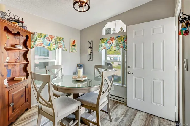 a kitchen with granite countertop a sink stainless steel appliances and cabinets