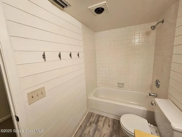 a bathroom with a sink a toilet and bathtub