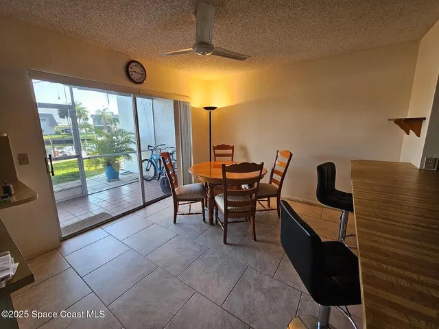 a reading room with furniture and a large window