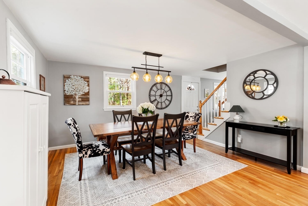 19 Dustin Young Lane Billerica, MA 01821 - Photo 11 of 37 a view of a dining room with furniture window and wooden floor