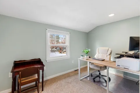 a bedroom with a bed and a table in it