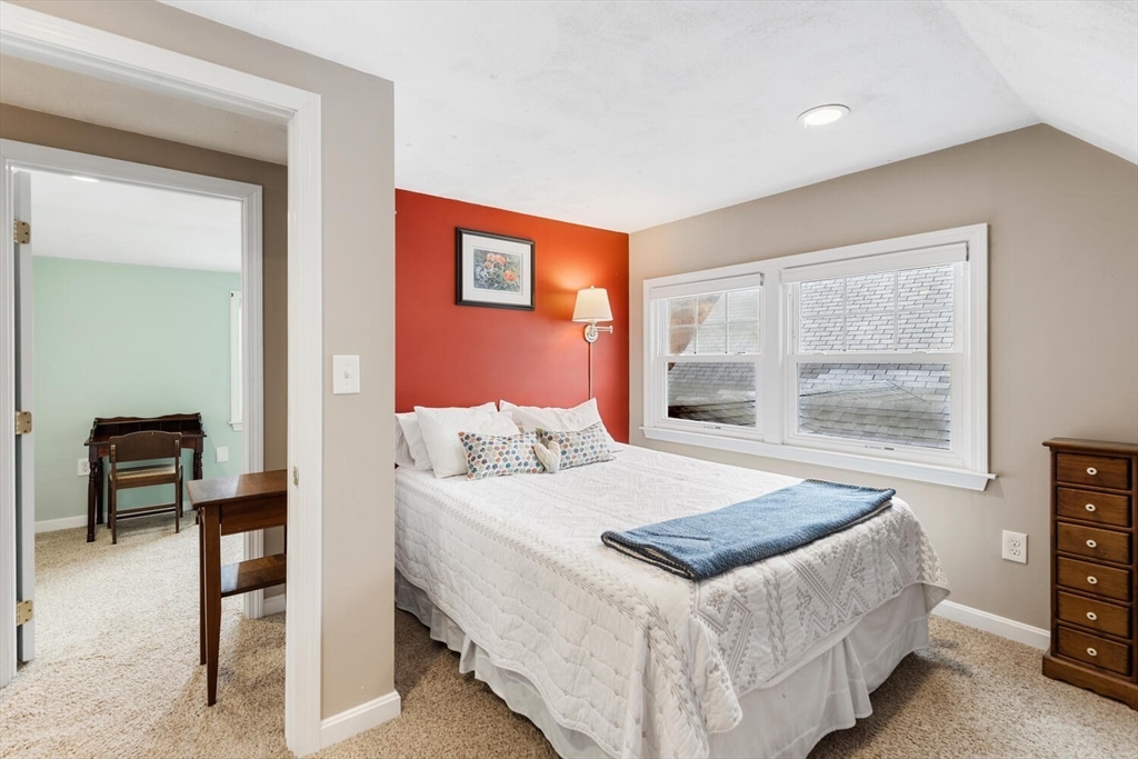 19 Dustin Young Lane Billerica, MA 01821 - Photo 25 of 37 a bedroom with a bed and a table in it