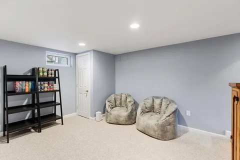 a view of a balcony with wooden floor and outdoor seating