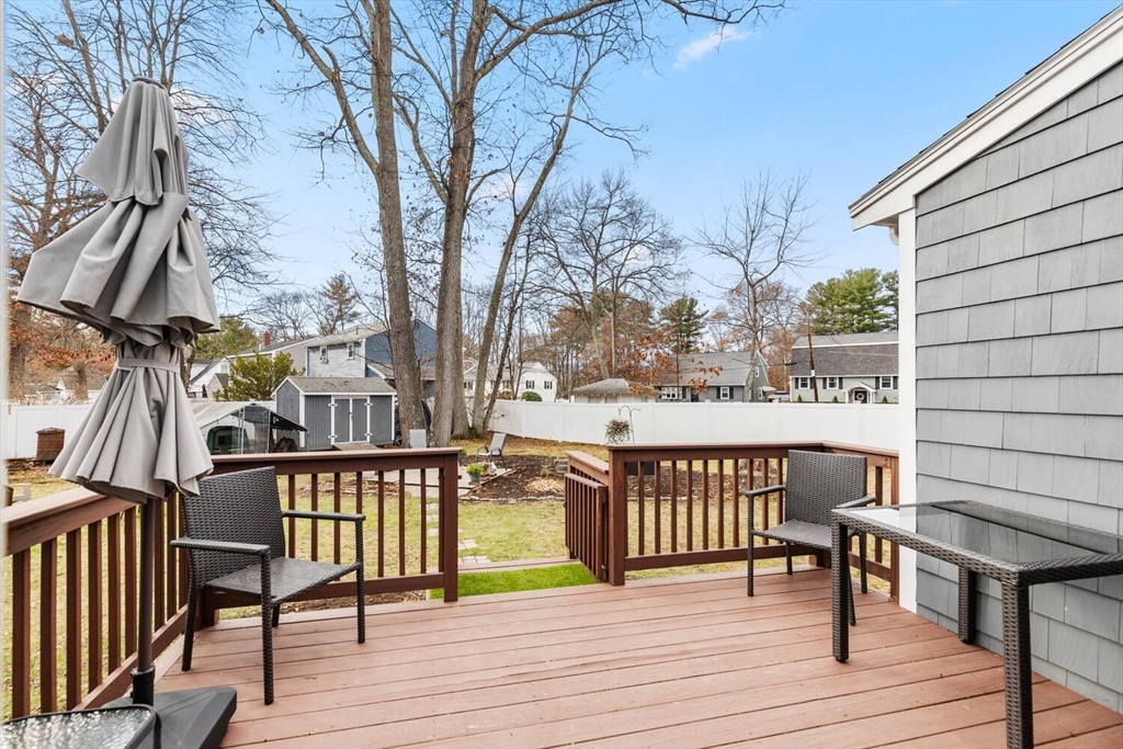19 Dustin Young Lane Billerica, MA 01821 - Photo 29 of 37 a view of a balcony with wooden floor and outdoor seating