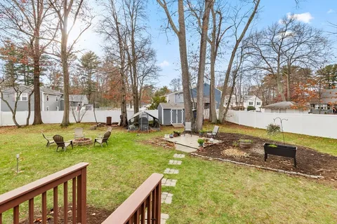 a view of a house with pool and a yard