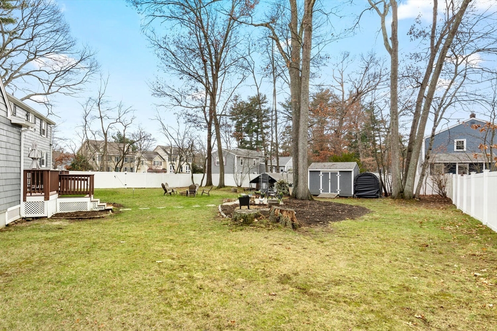 19 Dustin Young Lane Billerica, MA 01821 - Photo 33 of 37 a view of a house with backyard and sitting area