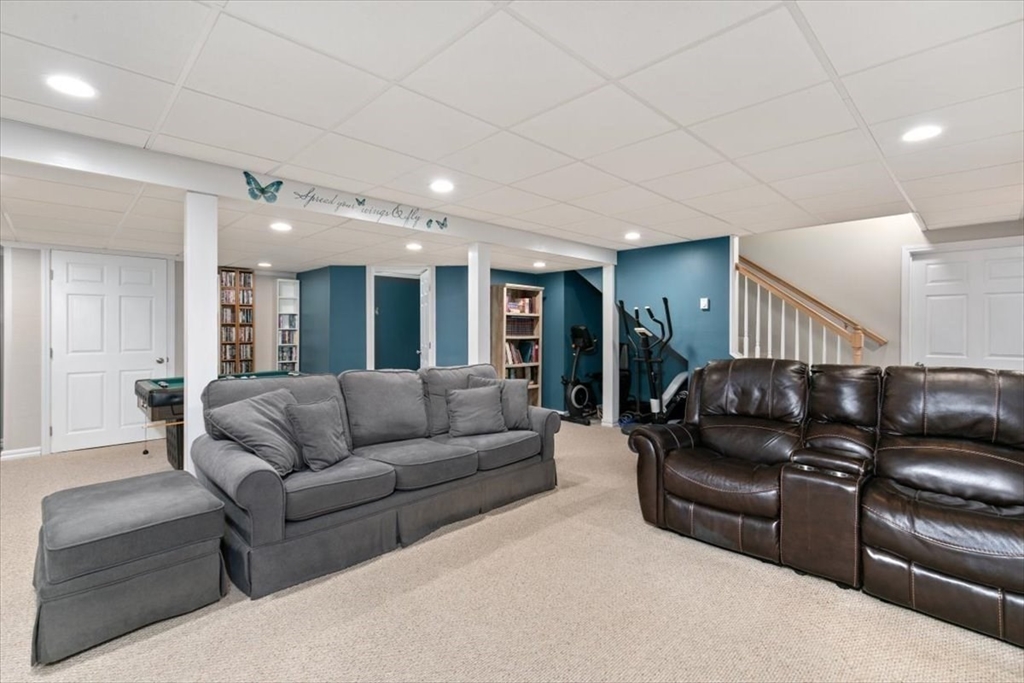 135 Pepperell Road Groton, MA 01450 - Photo 30 of 41 a living room with furniture and a mirror