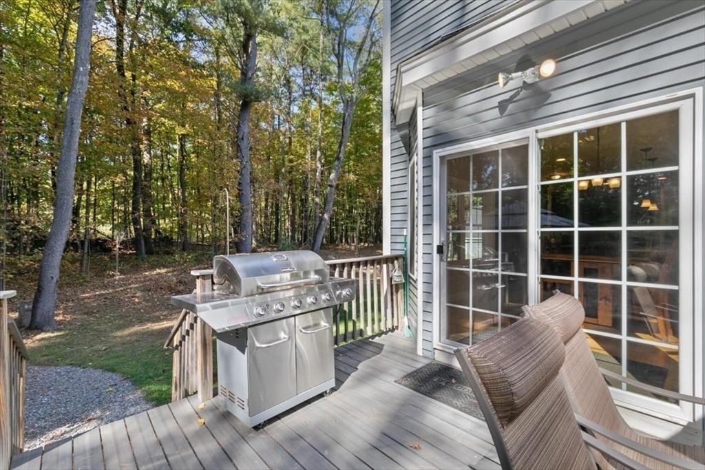 135 Pepperell Road Groton, MA 01450 - Photo 33 of 41 a view of a deck with wooden floor and fence