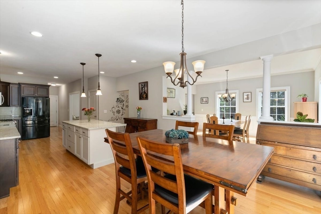 135 Pepperell Road Groton, MA 01450 - Photo 9 of 41 a large kitchen with a table and chairs