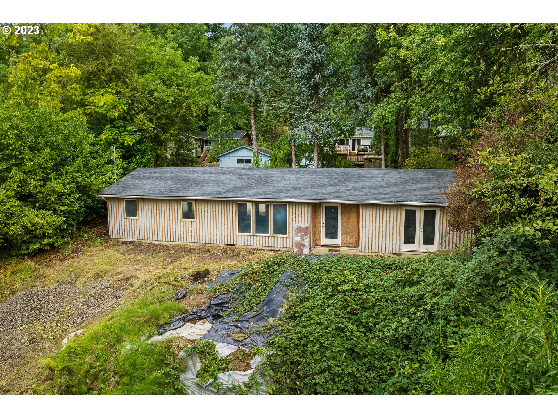 15370 Twin Fir Road Lake Oswego, OR 97035 - Photo 12 of 19 a view of a house with yard and a garden