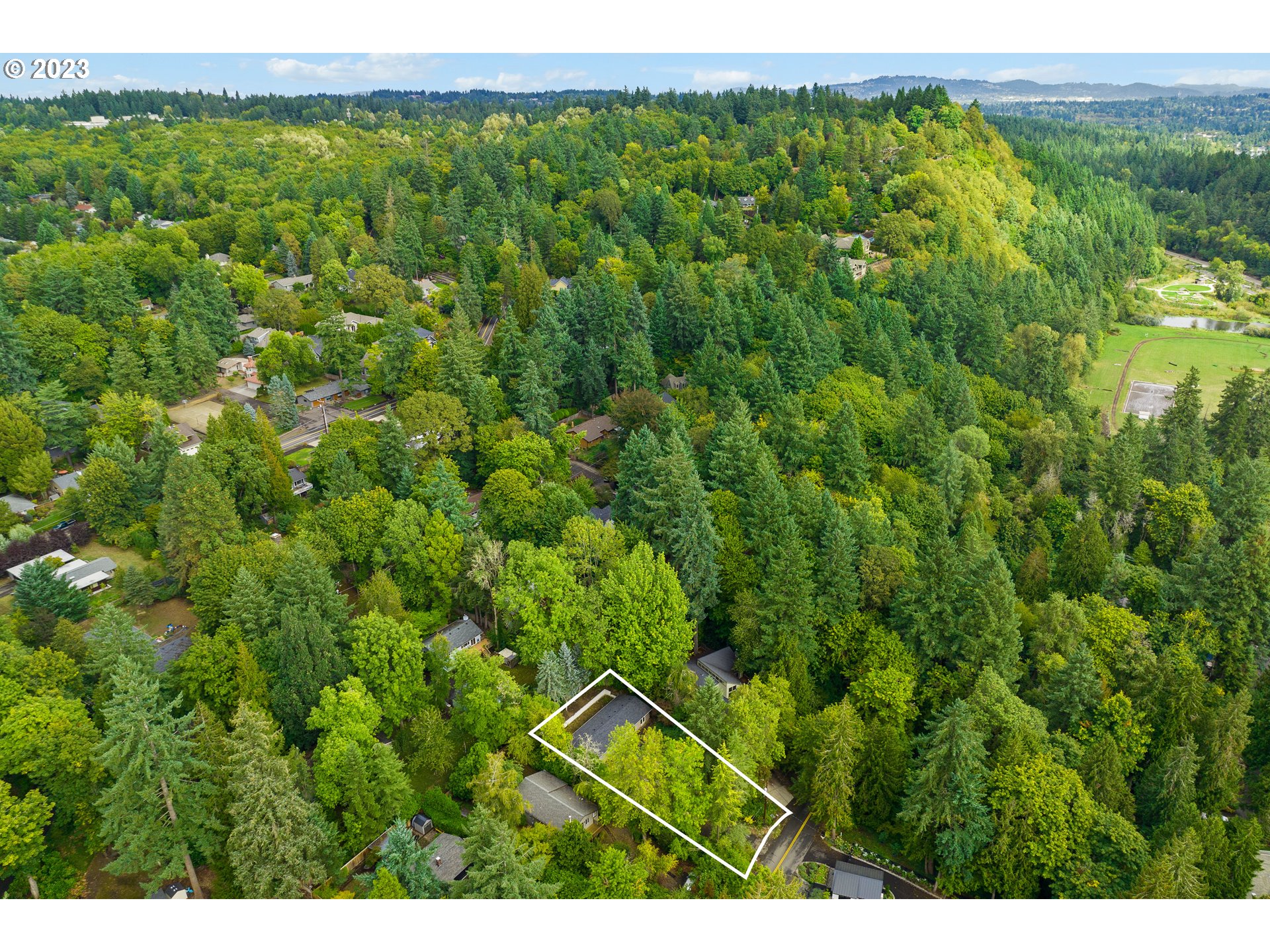 15370 Twin Fir Road Lake Oswego, OR 97035 - Photo 15 of 19 a view of a lush green forest with a lush green forest