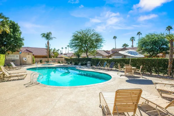 a view of a swimming pool with a patio