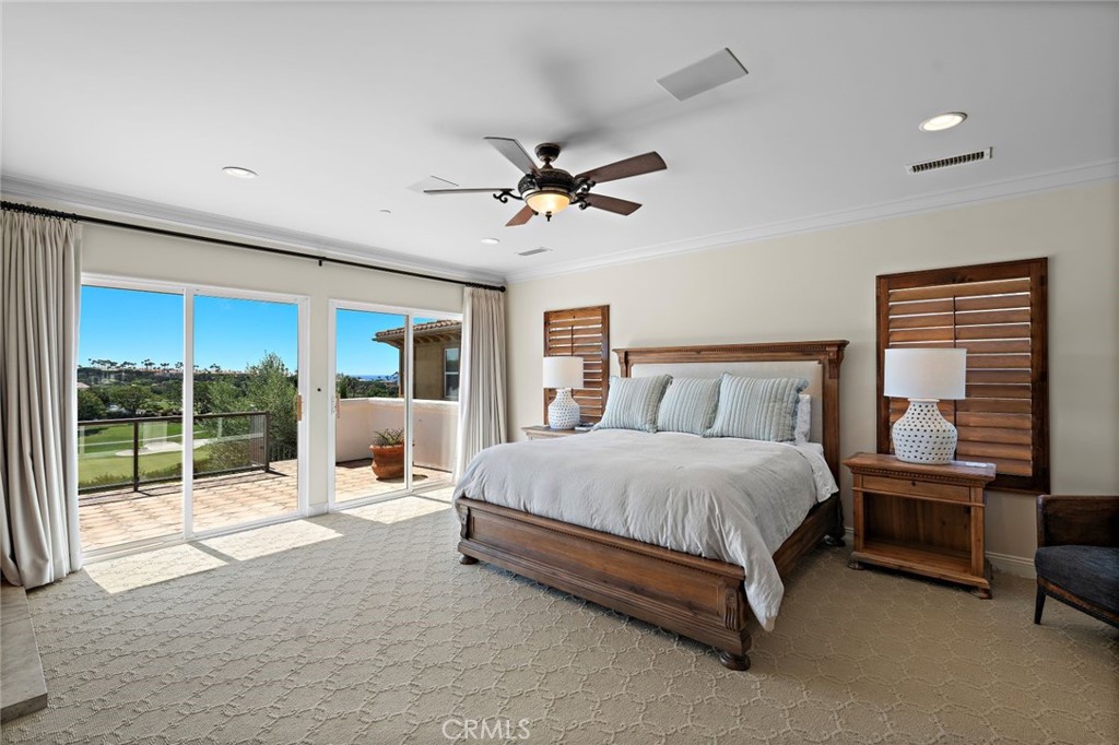 5 Via Monarca Street Dana Point, CA 92629 - Photo 18 of 64 a spacious bedroom with a bed and large window