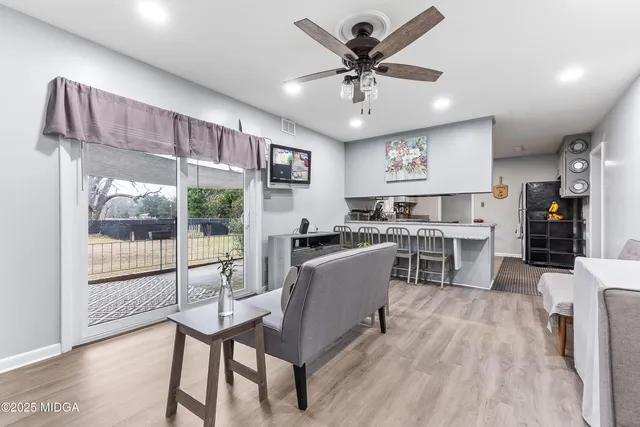 a view of a dining room with furniture window and wooden floor