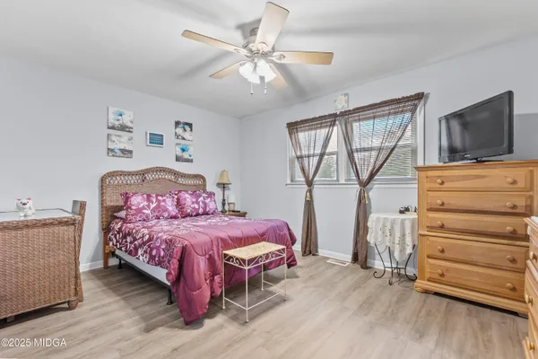 a bedroom with a bed and furniture