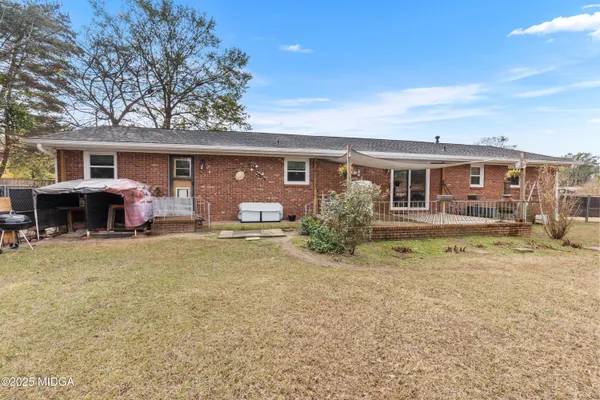 a front view of house with yard and seating space