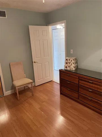 a room with furniture and wooden floor