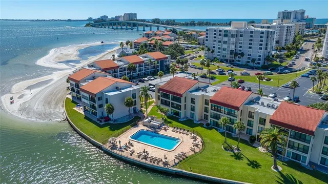 a view of a lake with a table and chairs